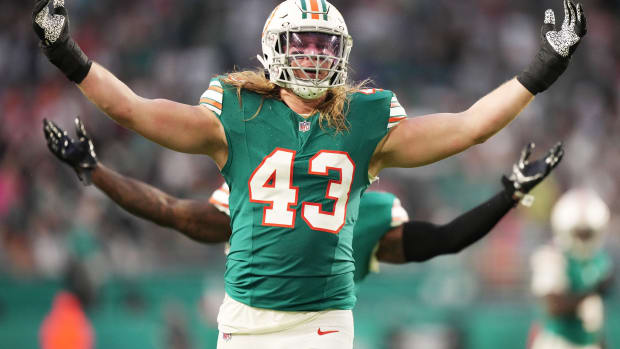 Miami Dolphins linebacker Andrew Van Ginkel (43) and linebacker David Long Jr., rear, celebrate a sack against the Dallas Cowboys during the first half of an NFL game at Hard Rock Stadium in Miami Gardens, Dec. 24, 2023.